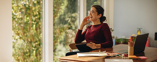Female artist smiling at home