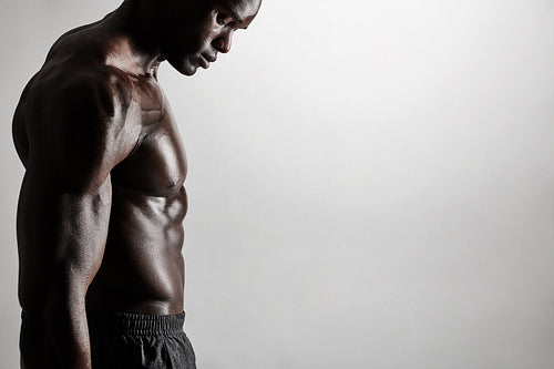 Torso of a muscular man with copyspace