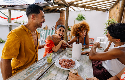 Group of friends enjoying petiscos outdoors in Rio de Janeiro