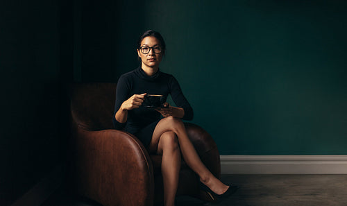 Independent business woman with cup of coffee