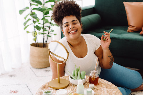 Healthy woman with beauty care products