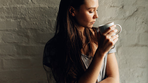 Woman holding a coffee cup