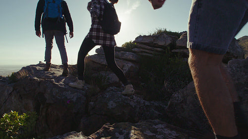 Group of people enjoying being on mountain peak
