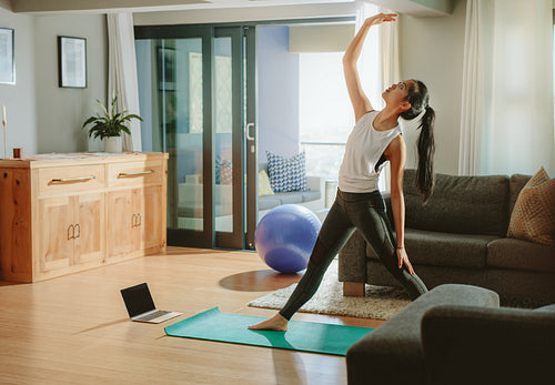 Woman working out in her living room