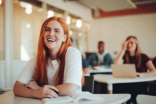 Pretty student in high school classroom