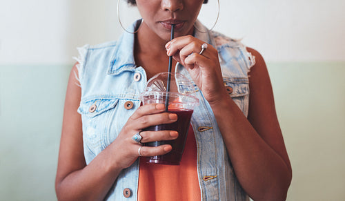 African woman drinking juice