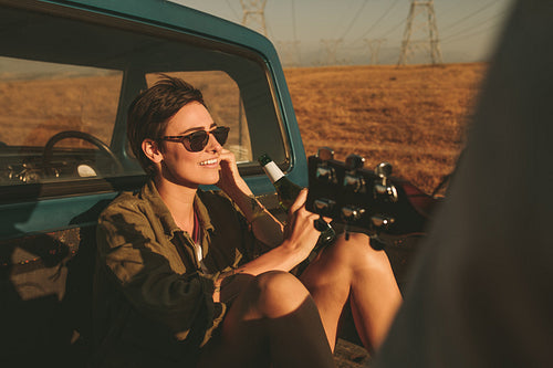 Woman enjoying on a road trip in her car