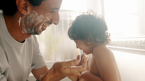 Fathers day with son: Having fun shaving together