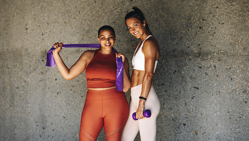 Two diverse females exercising together