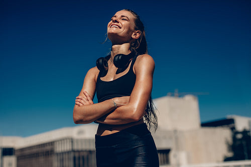 Sportswoman relaxing outdoors after workout