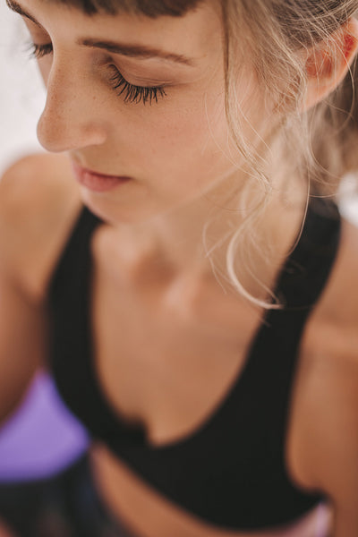 Woman sitting in yoga meditation