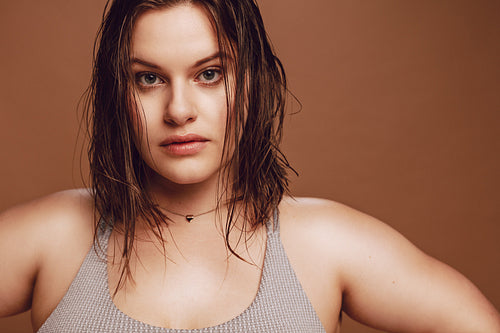 Plus size female model looking at camera