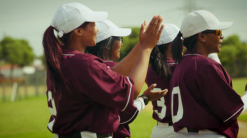 Team claps and encourages on baseball field