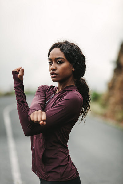 Young woman exercising in jogging gear