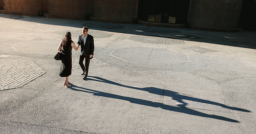 Aerial view of business colleagues meeting and shaking hands outdoors