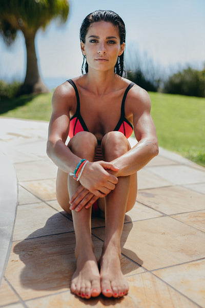 Attractive young woman by the swimming pool
