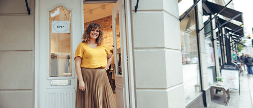 Beautiful woman running a fashion store