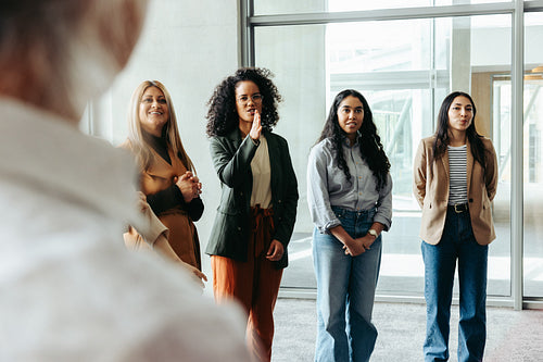 Group of women networking at a business conference, engaging in conversation and collaboration
