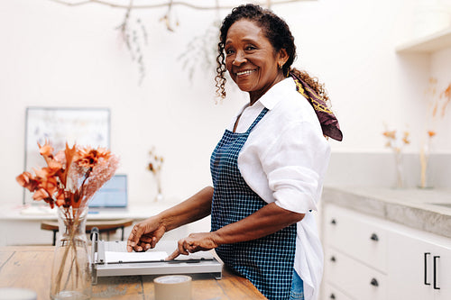 Portrait of a happy senior woman working in her flower store