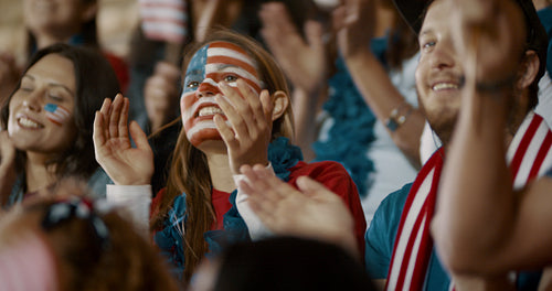 American football fans cheering in stands