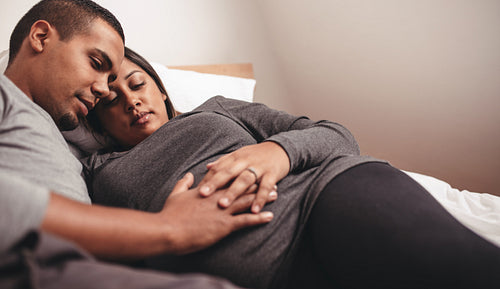 Loving young couple expecting baby