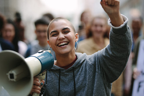 Woman in a street demonstration with a megaphone