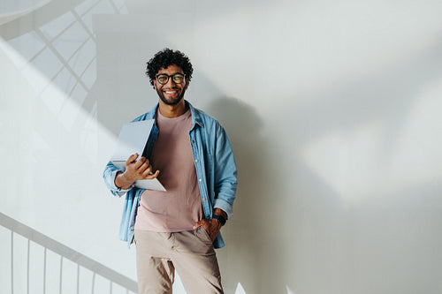 Successful business man in a modern office working on laptop