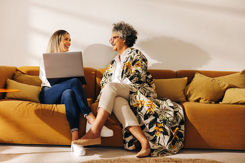 Cheerful businesswomen working in an office lobby