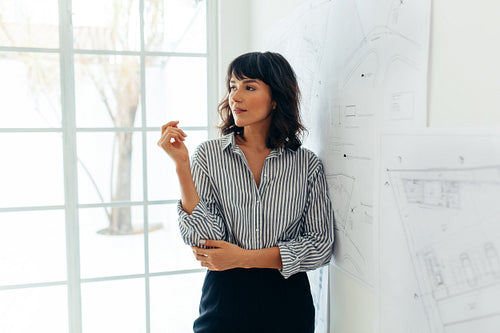 Female architect standing in office