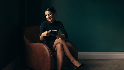 Asian female model smiling with coffee