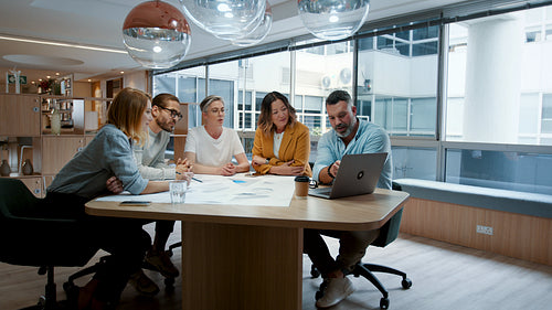 Creative designers having a meeting in an office, collaborating on an architectural project