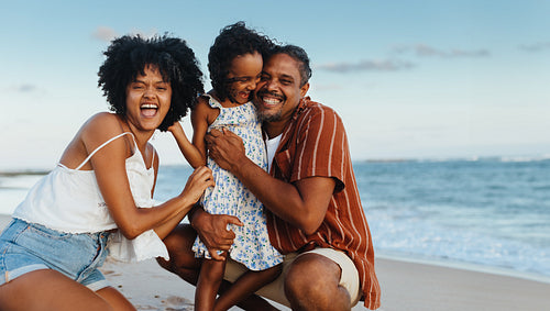 Happy family enjoying a beach vacation with laughter and joy
