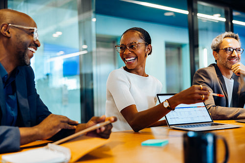 Diverse group discussing ideas in a bright and engaging office setting