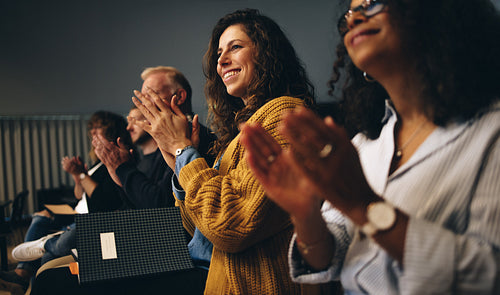 Business professionals applauding at a seminar