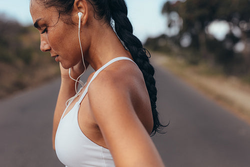 Fitness woman taking a breather after a run
