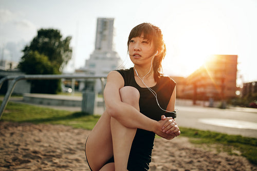 Fitness female relaxing after workout.