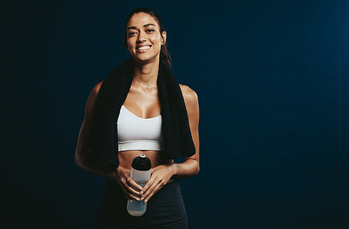 Fit woman taking break after workout
