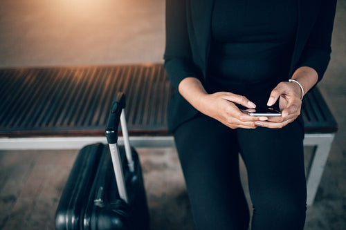 Woman waiting in public transport station