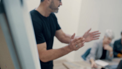 Businesspeople clapping hands after a successful presentation
