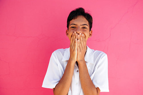 Cheerful queer boy embracing his identity