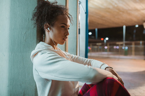 Urban runner resting after training