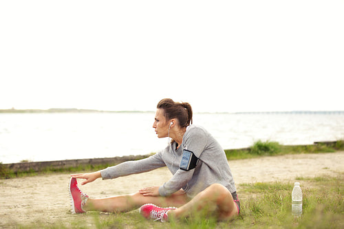 Female Runner Doing Stretching Outside
