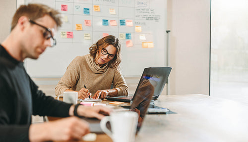 Collaborative business meeting in a tech startup office
