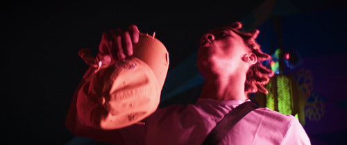 Vibrant young man dancing enthusiastically at a music concert