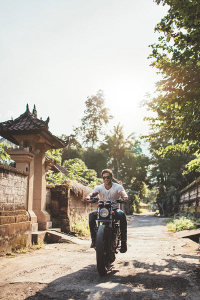Young couple out on a motorbike ride.