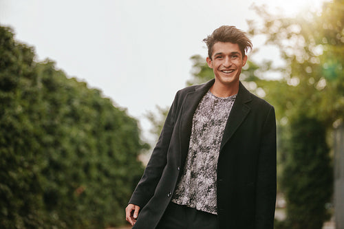 Handsome young man standing outdoors