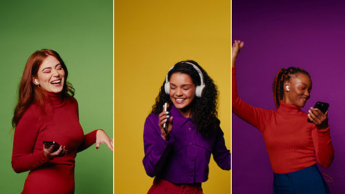 Happy women enjoying music, dancing, and having fun on color backgrounds