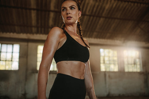 Strong female taking break after workout