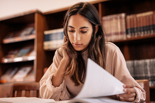 College student studying in public library