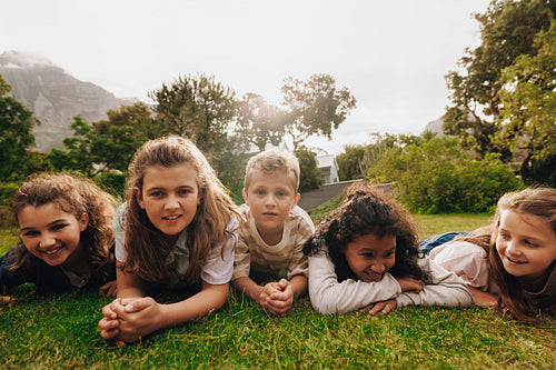 Group of kids enjoying time together outdoors in a scenic nature setting